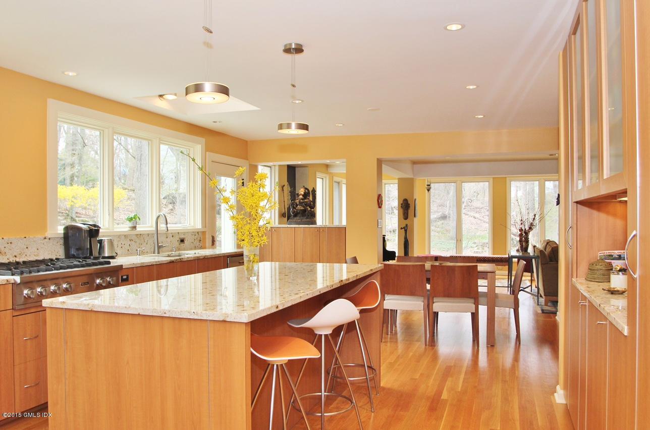 15 Ferncliff Road Cos Cob, CT 06807 - Photo 11 of 16 a large kitchen with stainless steel appliances a large window and wooden floor