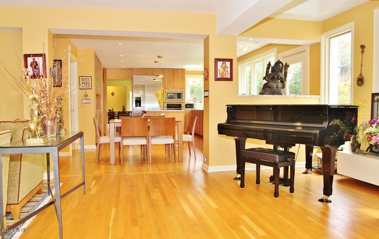 15 Ferncliff Road Cos Cob, CT 06807 - Photo 15 of 16 a living room with couches chairs and kitchen view with wooden floor