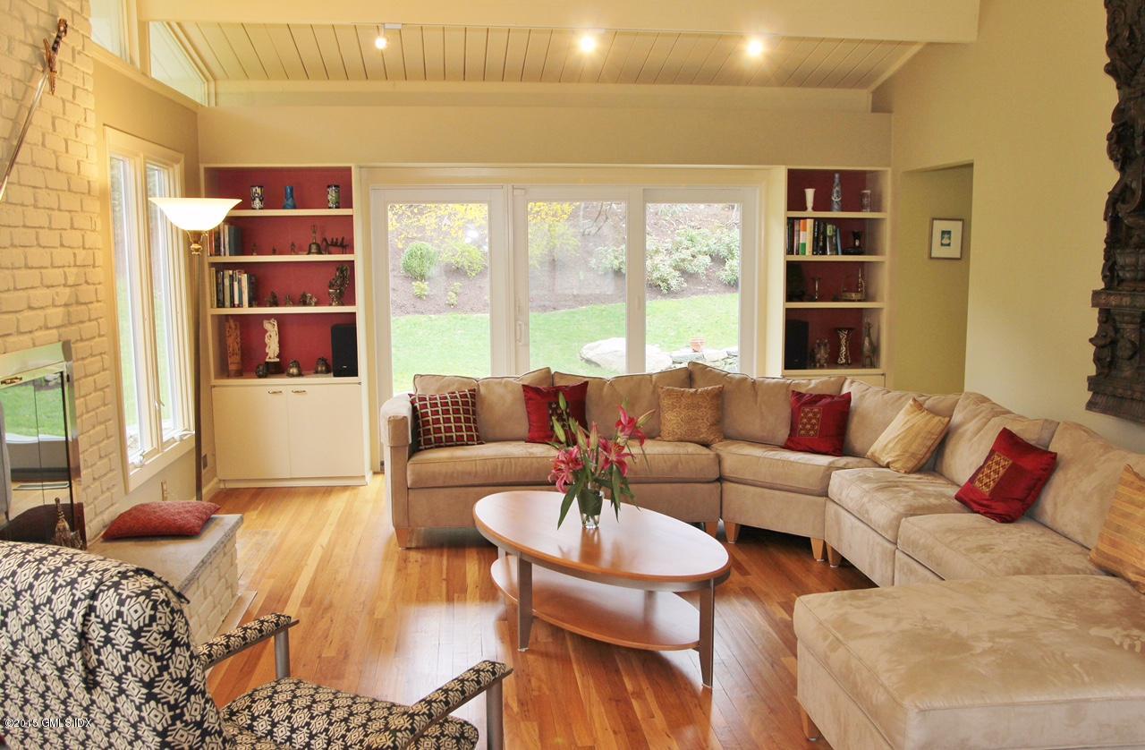 15 Ferncliff Road Cos Cob, CT 06807 - Photo 2 of 16 a living room with furniture and a book shelf