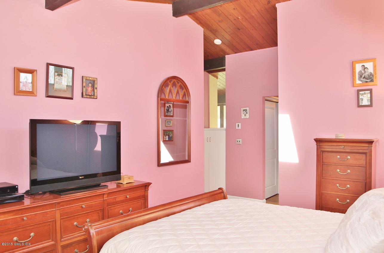 15 Ferncliff Road Cos Cob, CT 06807 - Photo 3 of 16 a bedroom with a bed and a flat screen tv