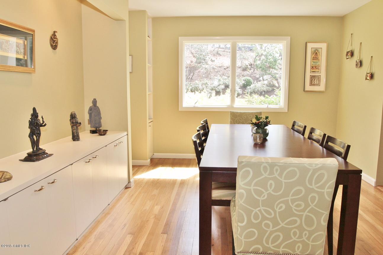 15 Ferncliff Road Cos Cob, CT 06807 - Photo 8 of 16 a dining room with wooden floor and a table
