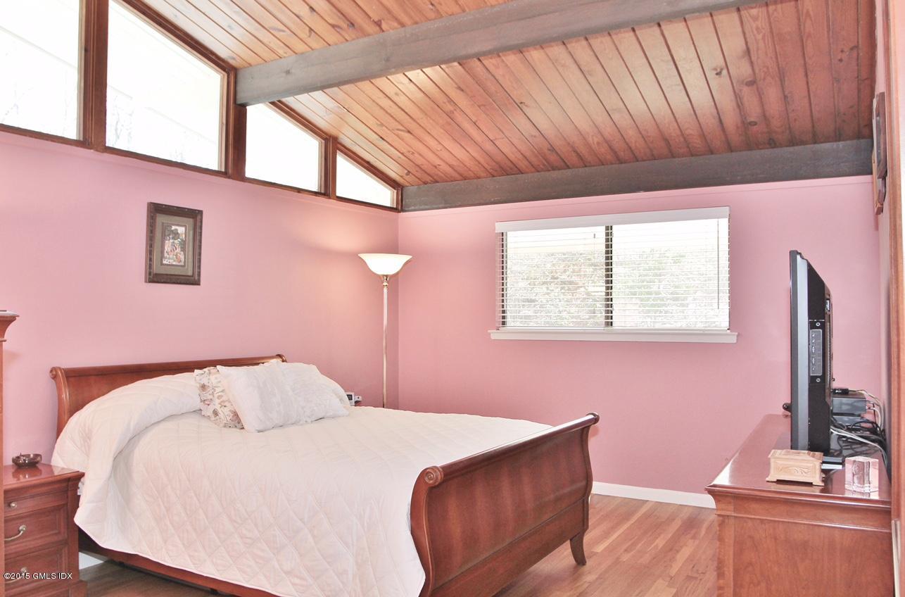 15 Ferncliff Road Cos Cob, CT 06807 - Photo 10 of 16 a bedroom with a bed next to a window
