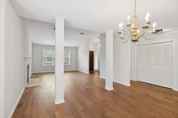 a view of a kitchen with a sink and refrigerator
