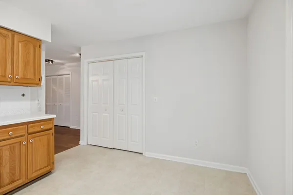 a kitchen with stainless steel appliances granite countertop a stove microwave and cabinets