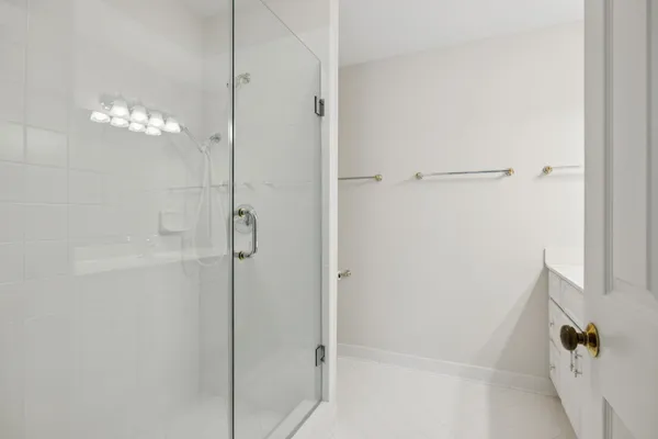 a bathroom with a sink vanity and a mirror