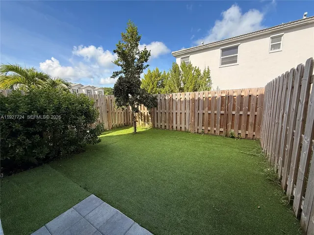 a view of a backyard with garden