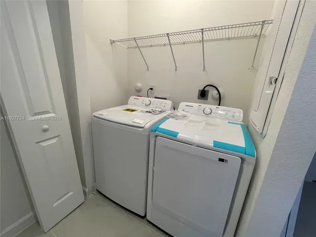 a utility room with dryer and washer