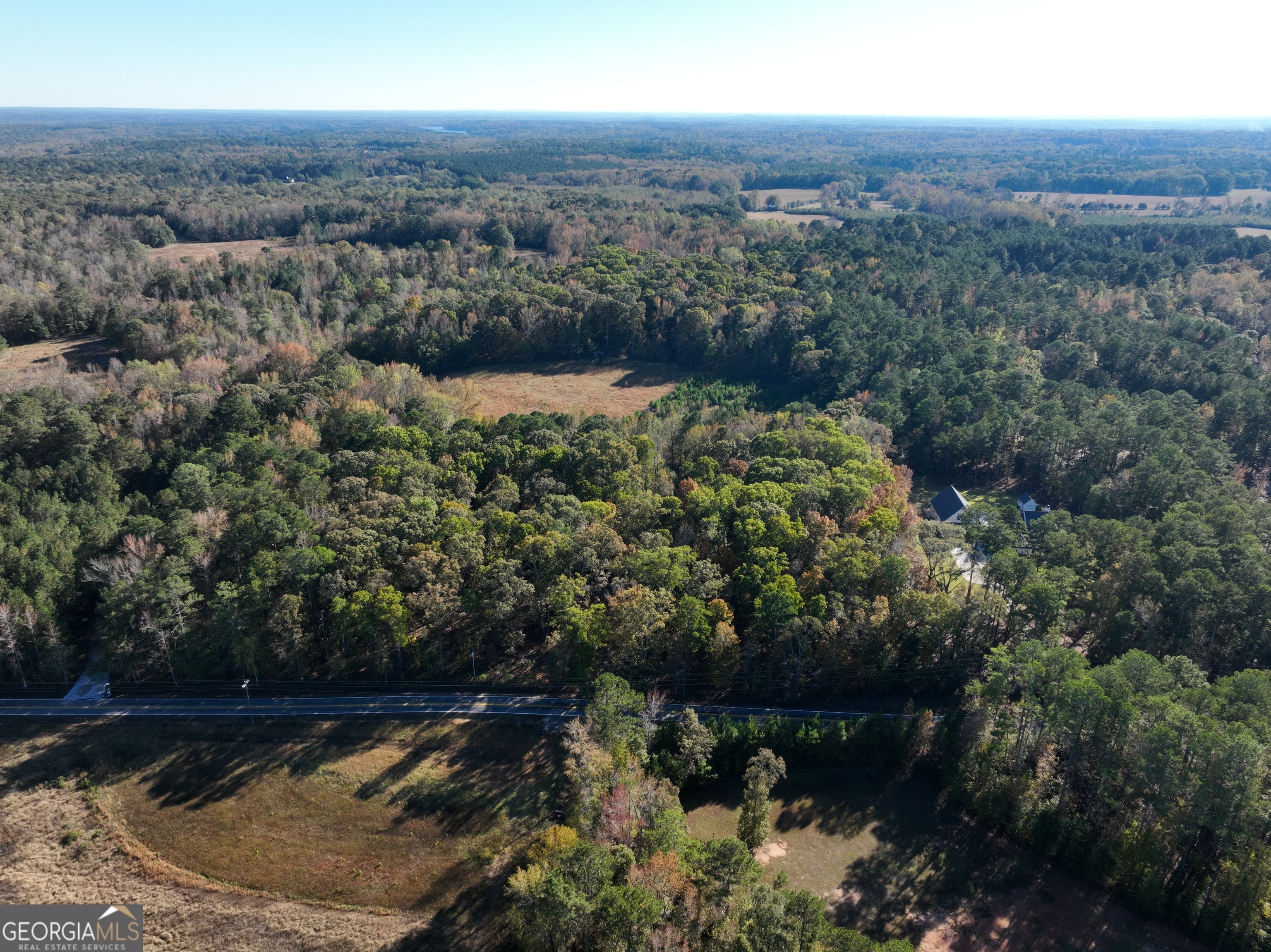 an aerial view of residential house and outdoor space