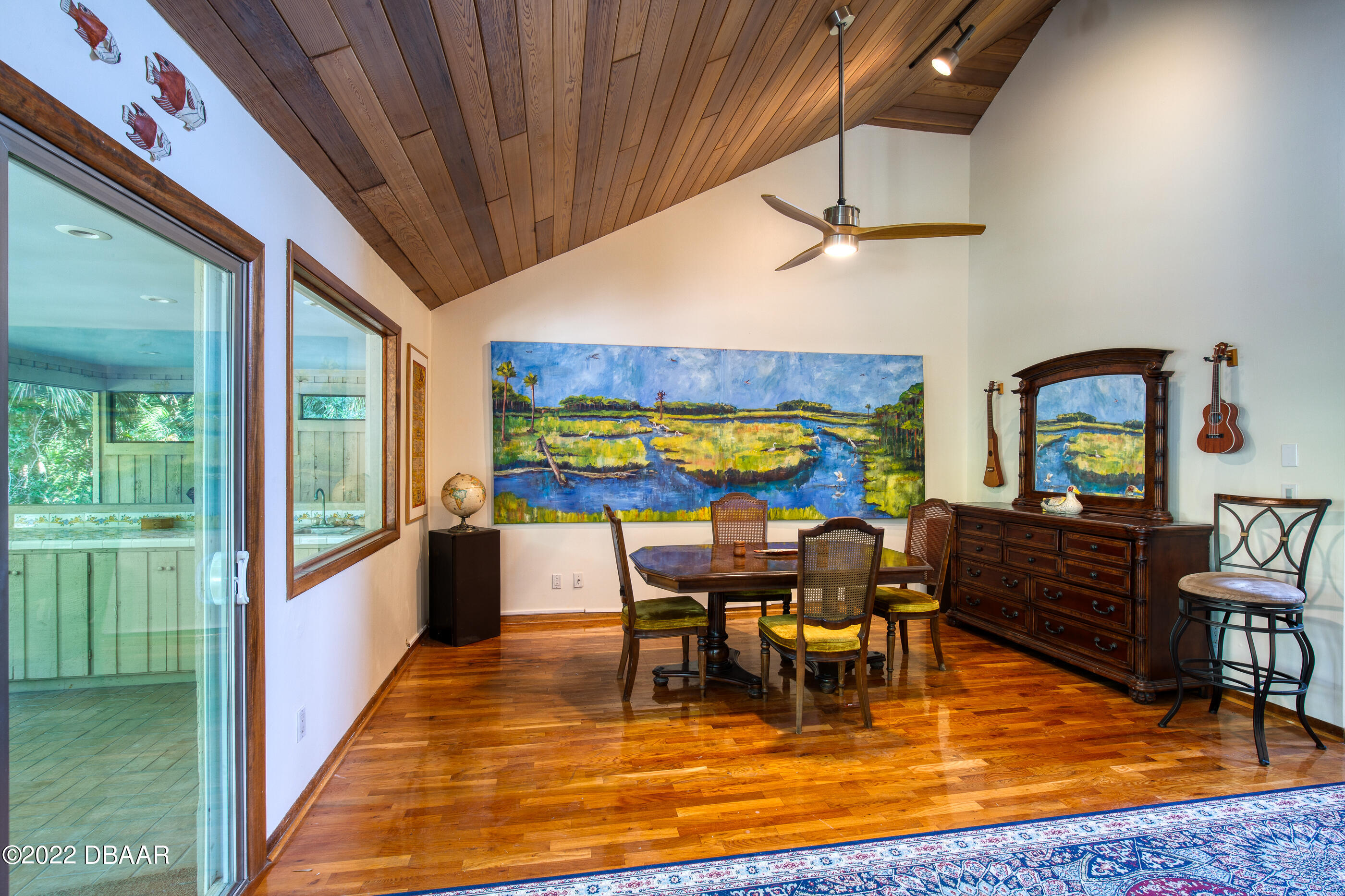110 River Bluff Drive Ormond Beach, FL 32174 - Photo 23 of 57 a view of a dining room with furniture a chandelier and wooden floor