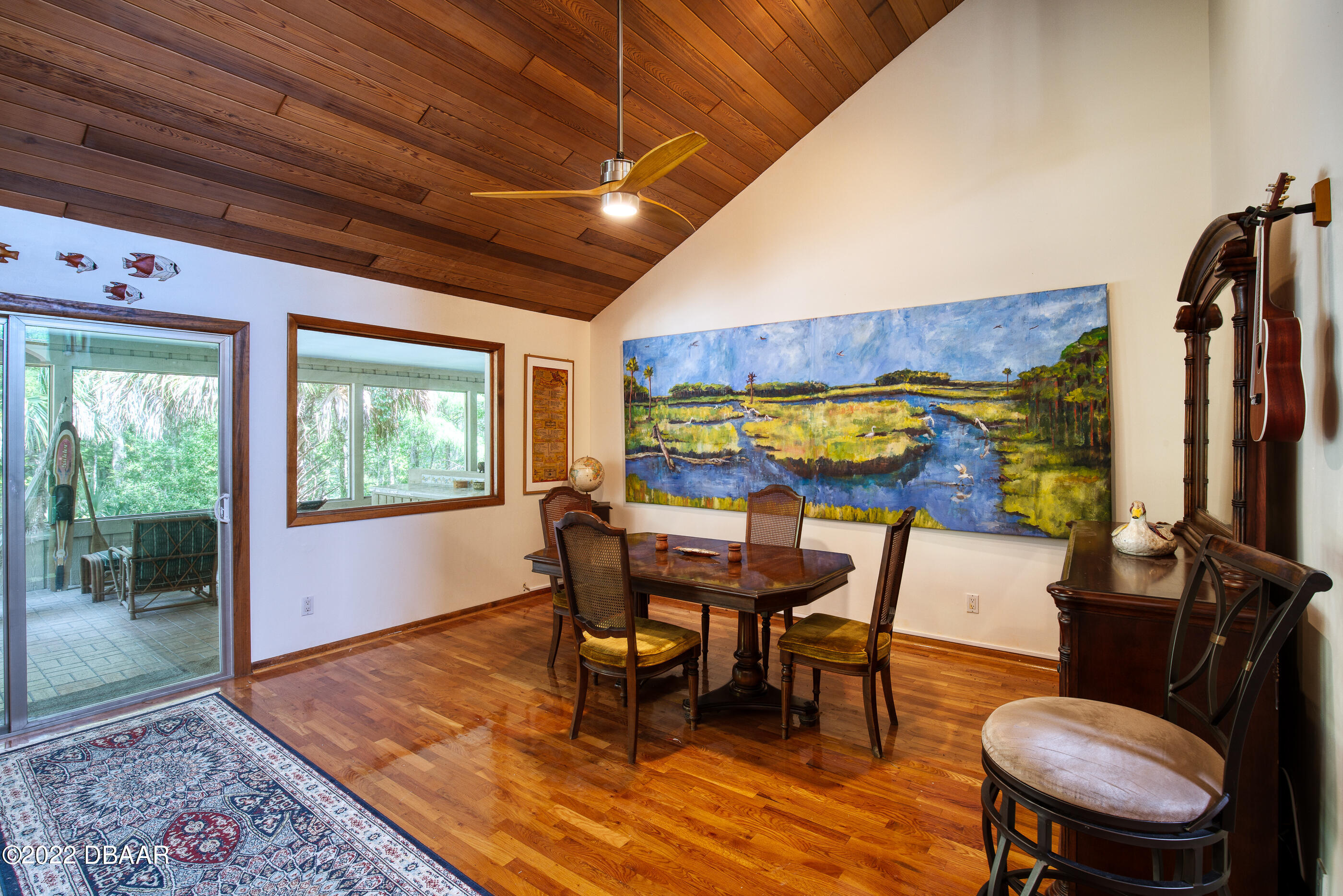 110 River Bluff Drive Ormond Beach, FL 32174 - Photo 24 of 57 a dining room with furniture and wooden floor
