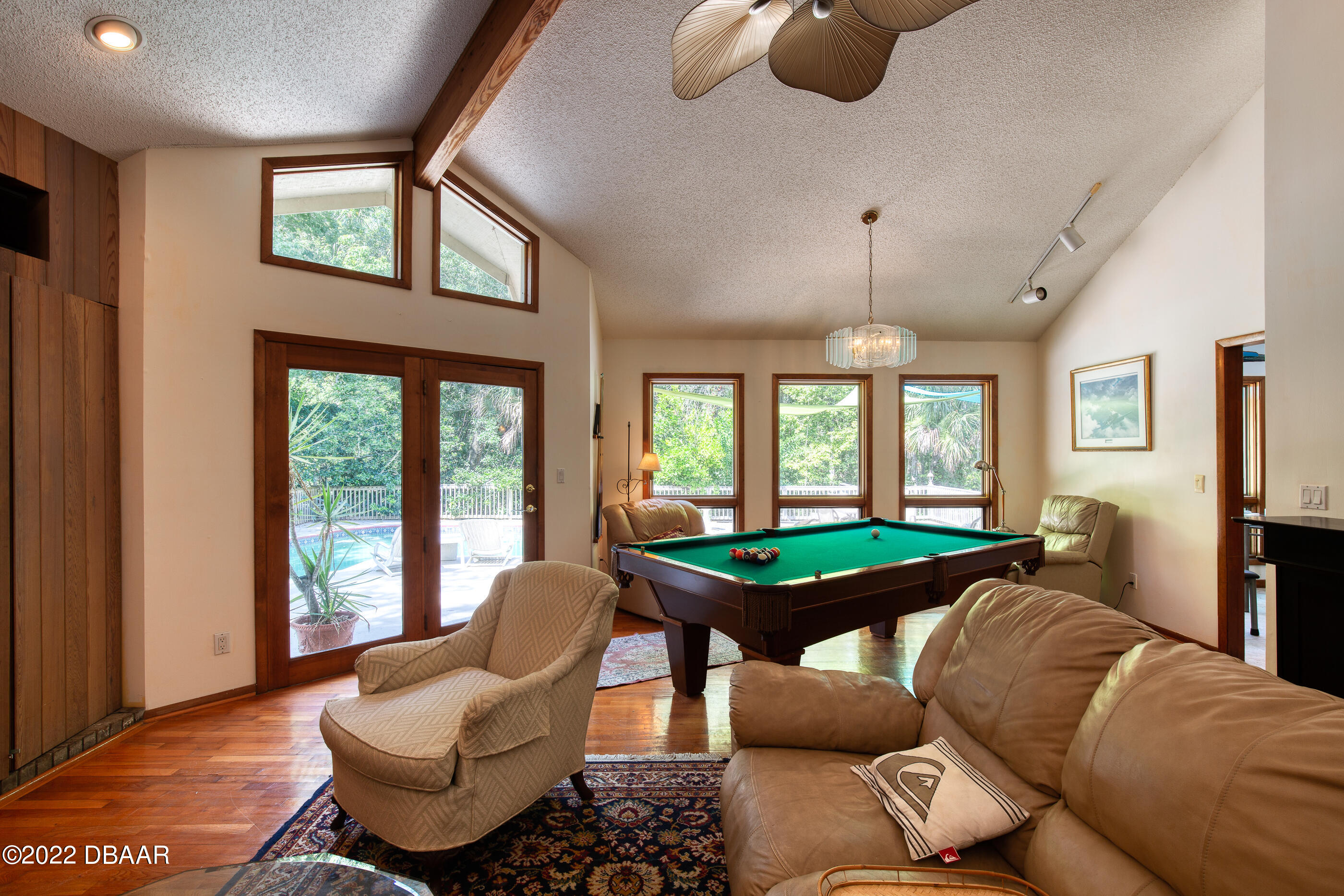 110 River Bluff Drive Ormond Beach, FL 32174 - Photo 25 of 57 a living room with furniture fireplace and large windows