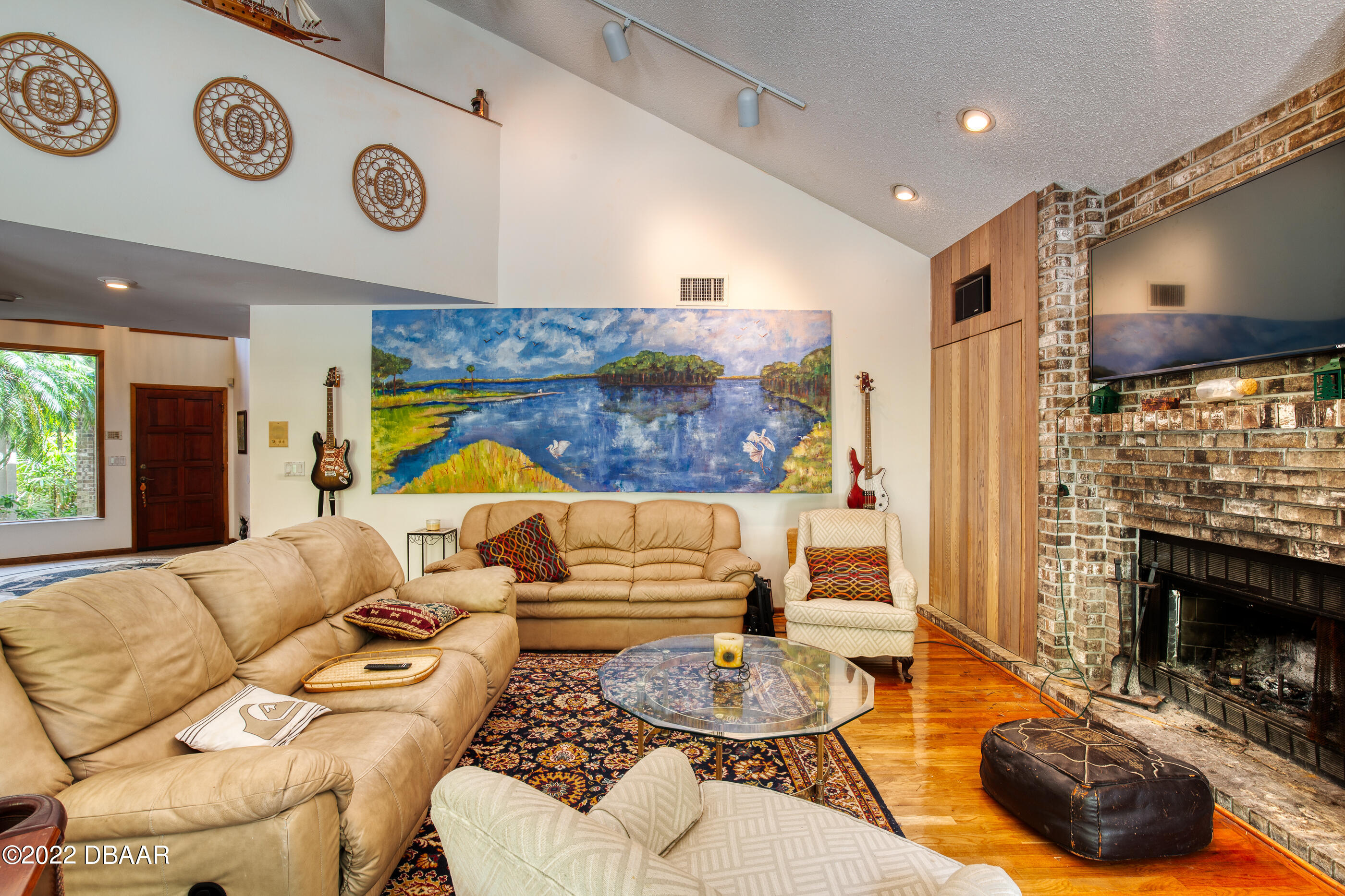 110 River Bluff Drive Ormond Beach, FL 32174 - Photo 26 of 57 a living room with furniture and a fireplace