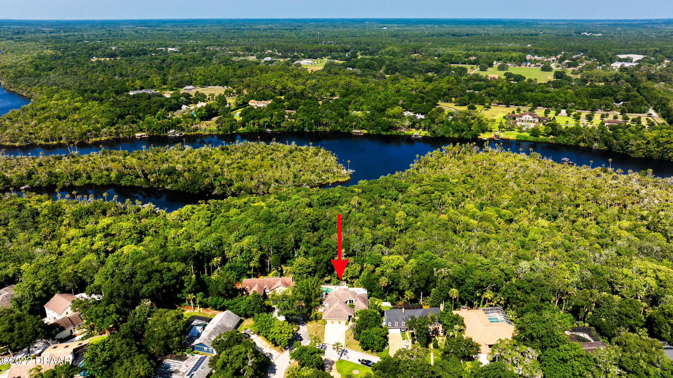 110 River Bluff Drive Ormond Beach, FL 32174 - Photo 3 of 57 a view of a lake with a flower garden