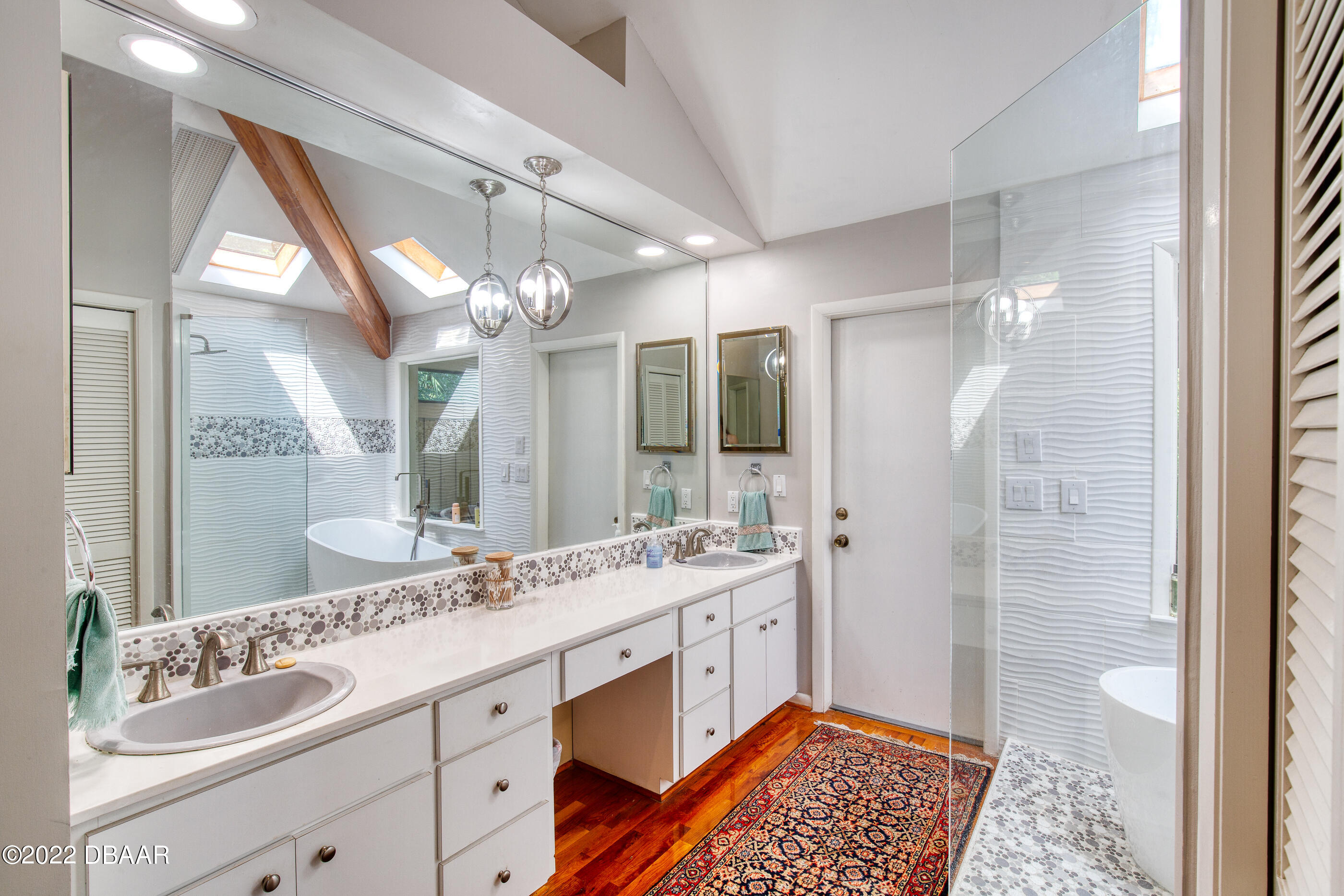 110 River Bluff Drive Ormond Beach, FL 32174 - Photo 35 of 57 a spacious bathroom with a double vanity sink mirror and shower