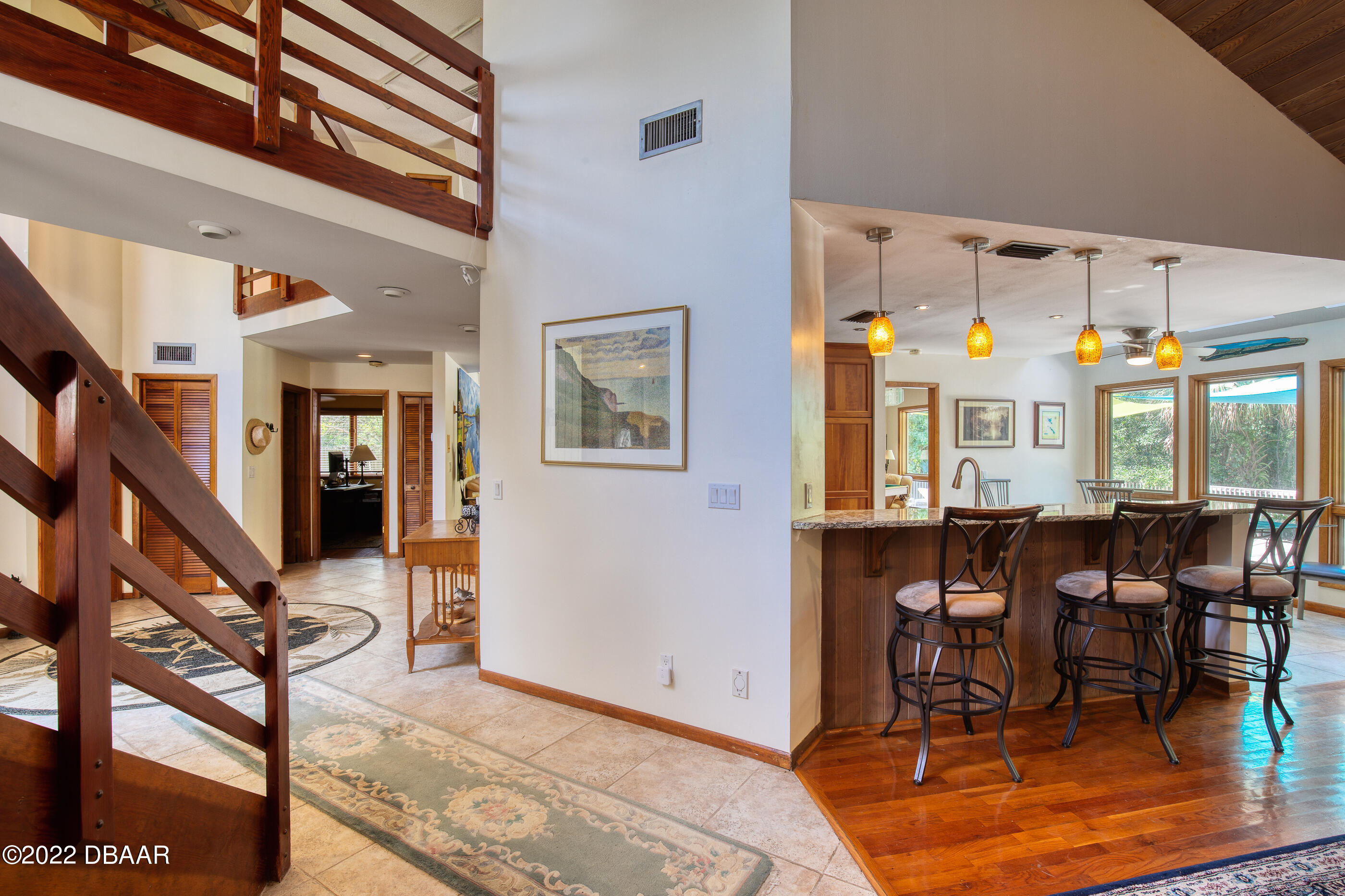 110 River Bluff Drive Ormond Beach, FL 32174 - Photo 37 of 57 a view of a dining room with furniture one side kitchen view and wooden floor