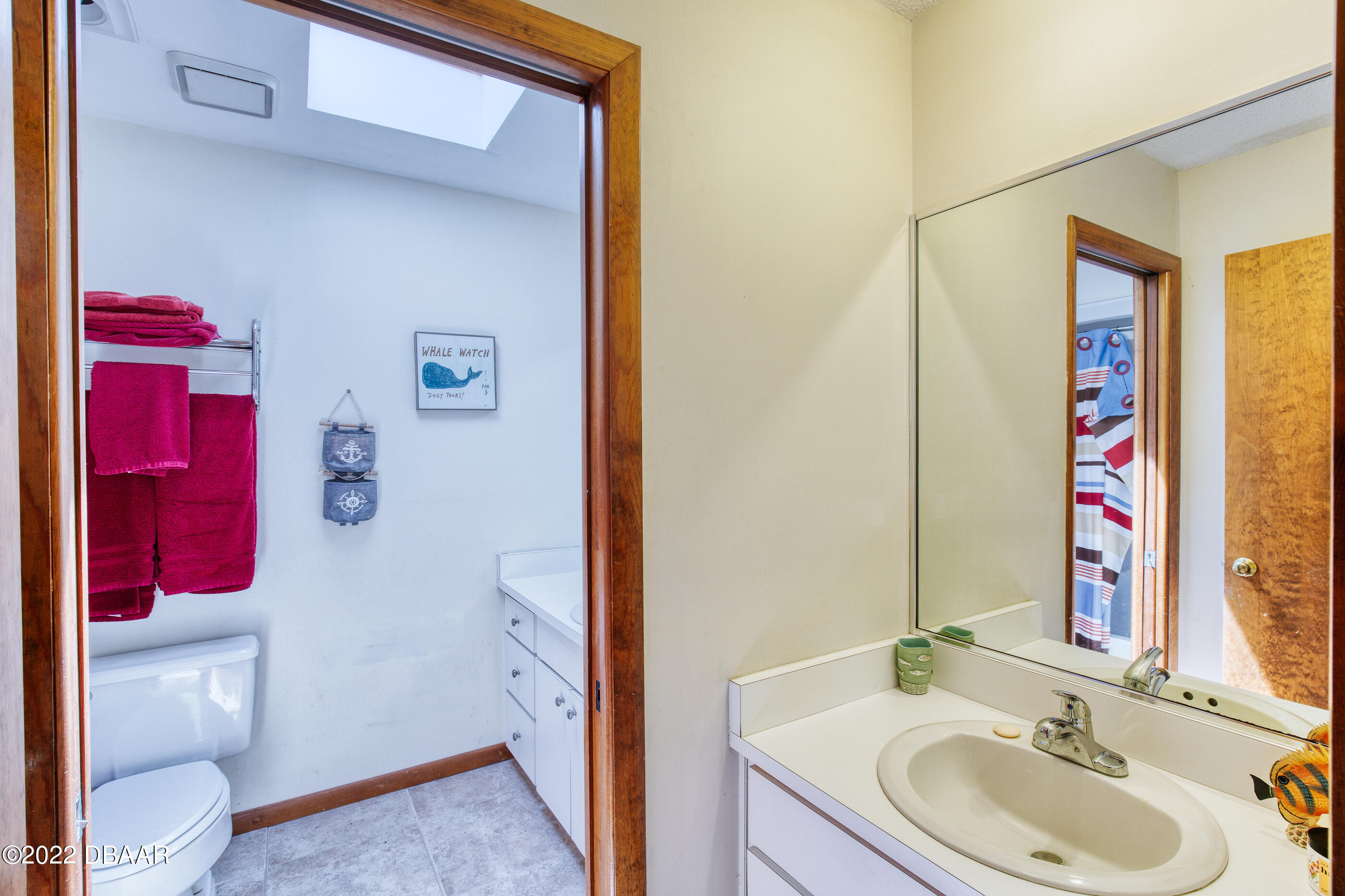 110 River Bluff Drive Ormond Beach, FL 32174 - Photo 41 of 57 a bathroom with a sink vanity and a mirror
