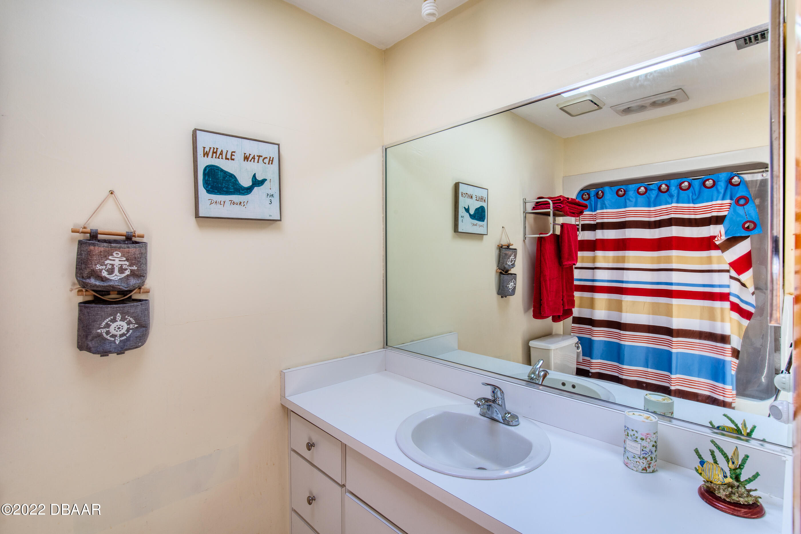 110 River Bluff Drive Ormond Beach, FL 32174 - Photo 42 of 57 a bathroom with a sink a vanity and a mirror