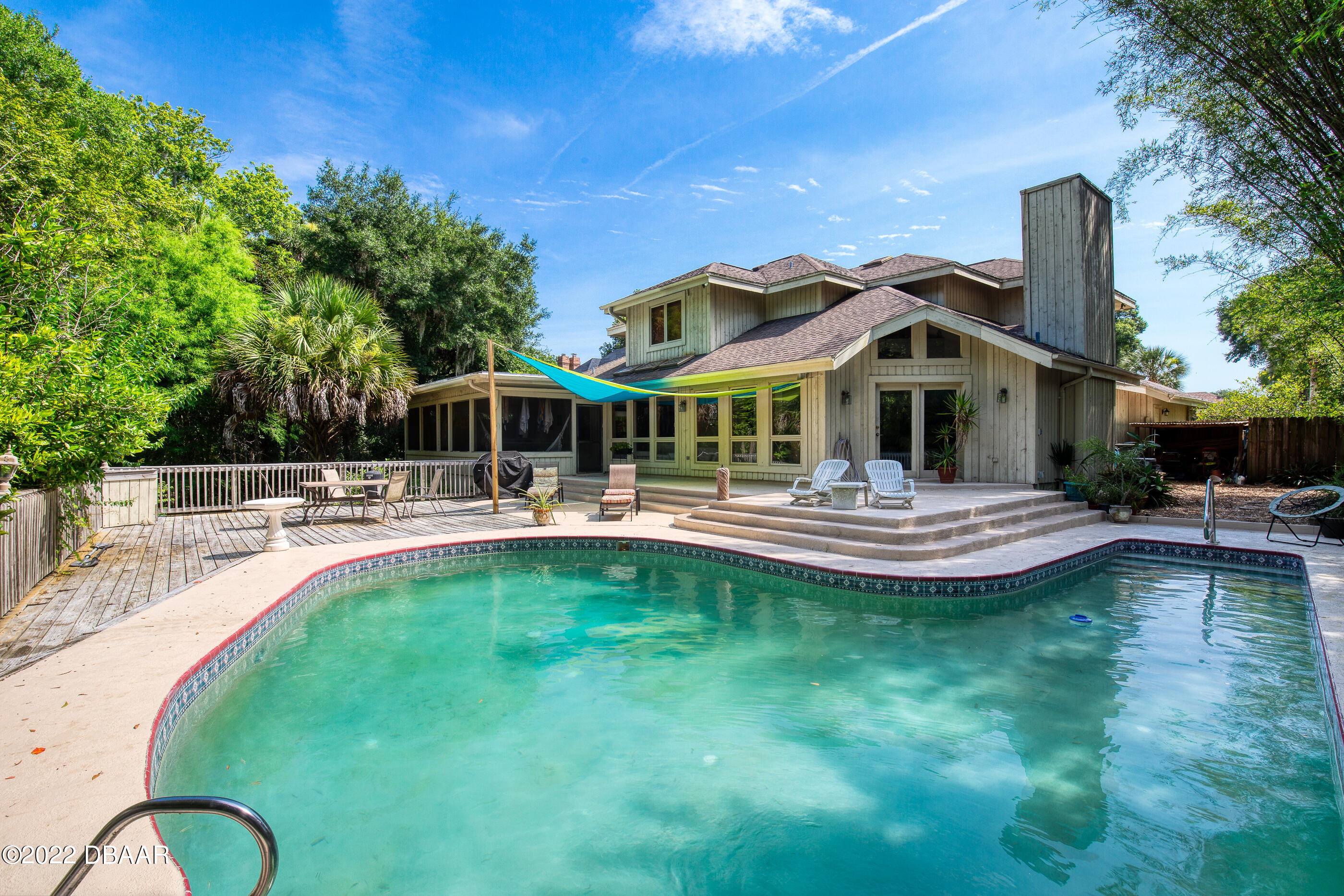 110 River Bluff Drive Ormond Beach, FL 32174 - Photo 50 of 57 a swimming pool with outdoor seating