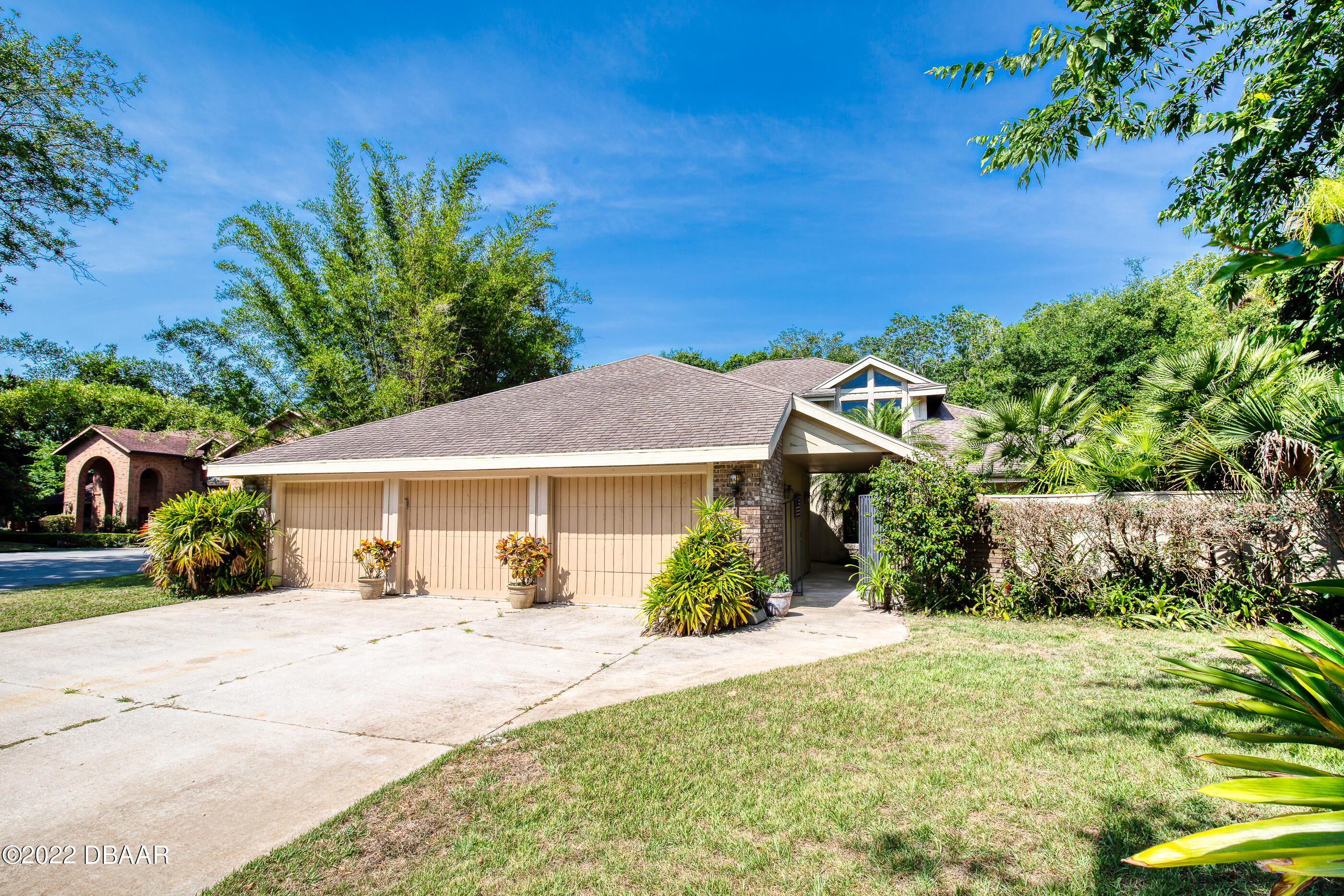 110 River Bluff Drive Ormond Beach, FL 32174 - Photo 5 of 57 front view of a house with a yard