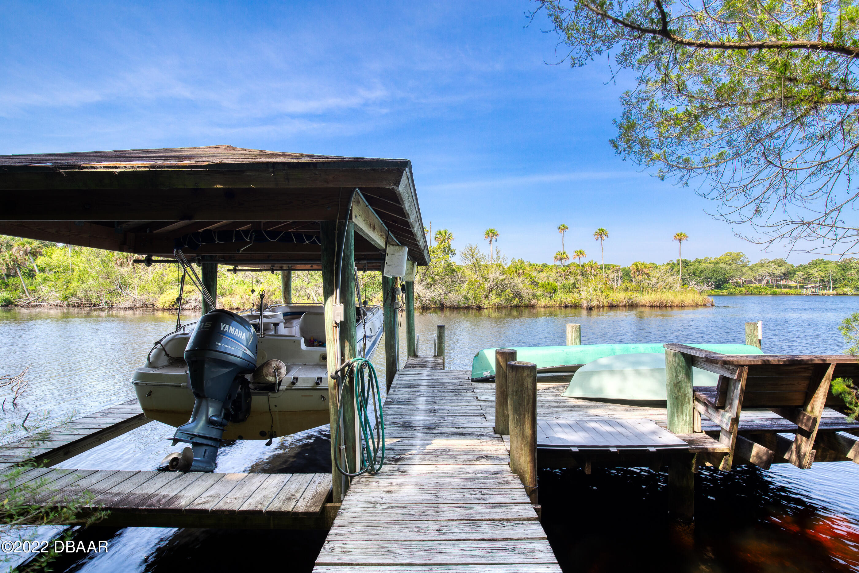 110 River Bluff Drive Ormond Beach, FL 32174 - Photo 56 of 57 a view of a balcony with chairs and a potted plant