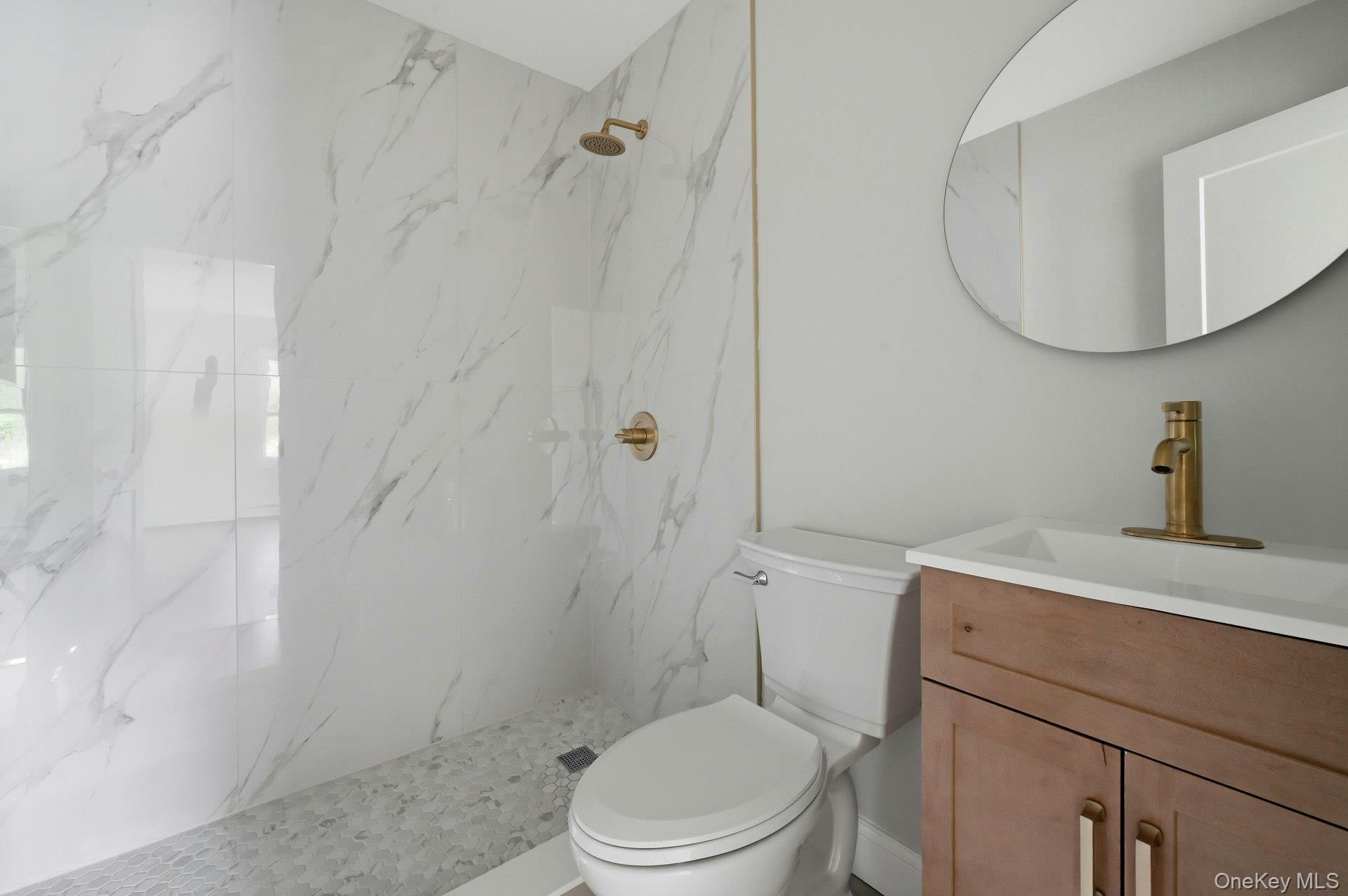 101 Rustic Road Centereach, NY 11720 - Photo 33 of 42 a bathroom with a sink a toilet and a mirror