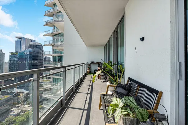 a view of balcony with furniture
