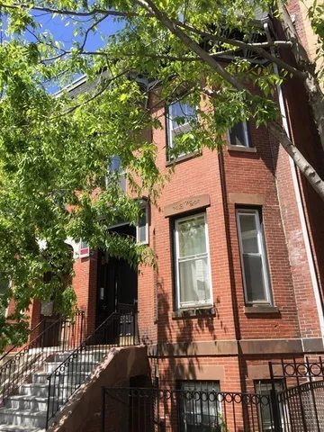front view of house with a tree