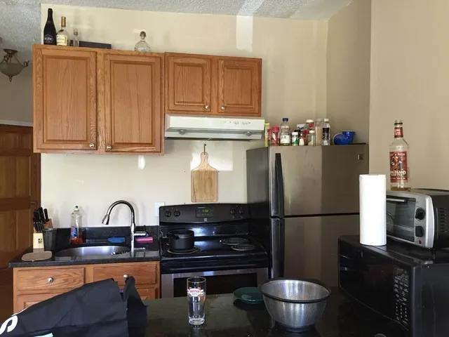 a kitchen with a sink and a stove