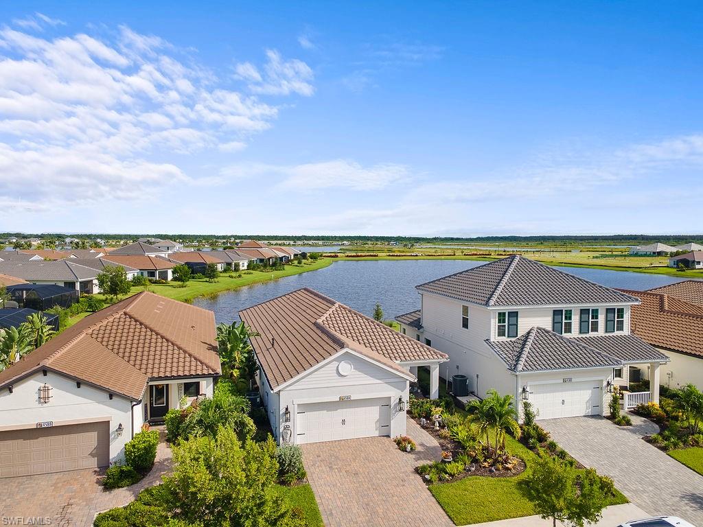 4584 Centaurus Circle Naples, FL 34120 - Photo 4 of 25 an aerial view of residential houses with outdoor space and ocean view