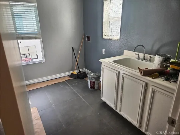 a storage room with window washer and dryer