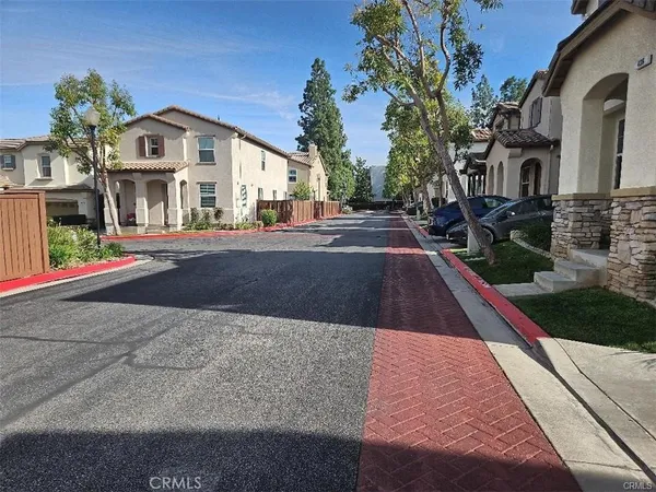 a view of multiple houses with a yard
