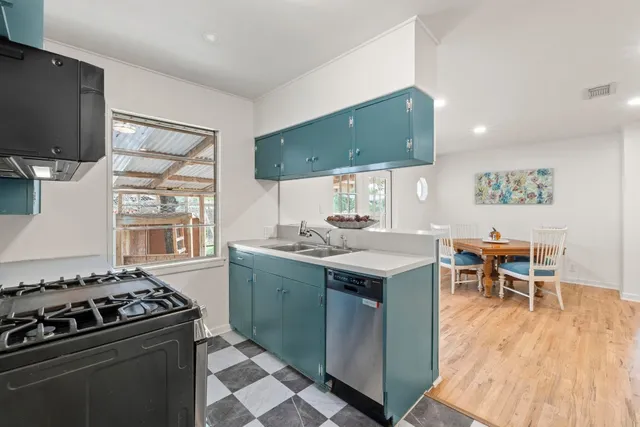 a kitchen with a stove and a sink