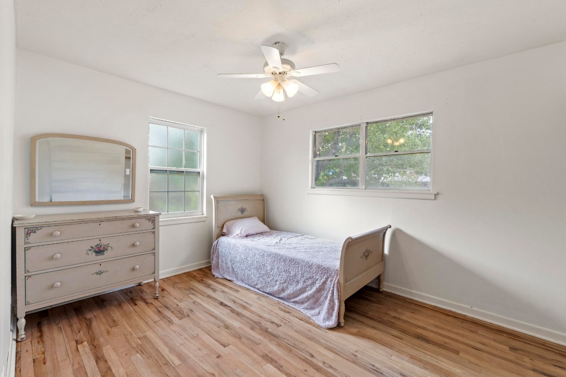 1805 Vine Street Georgetown, TX 78626 - Photo 15 of 32 a bedroom with a bed and a dresser