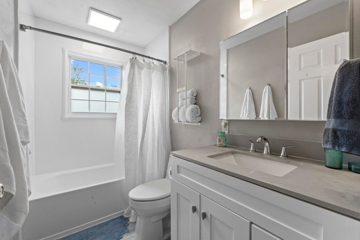 1805 Vine Street Georgetown, TX 78626 - Photo 16 of 32 a bathroom with a sink a toilet and shower