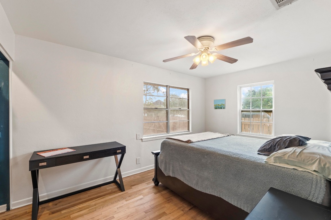 1805 Vine Street Georgetown, TX 78626 - Photo 17 of 32 a bedroom with a bed and window