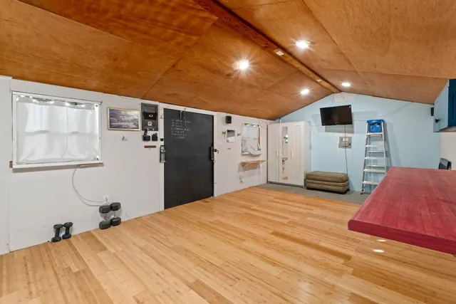 a view of a chairs setting on the roof deck