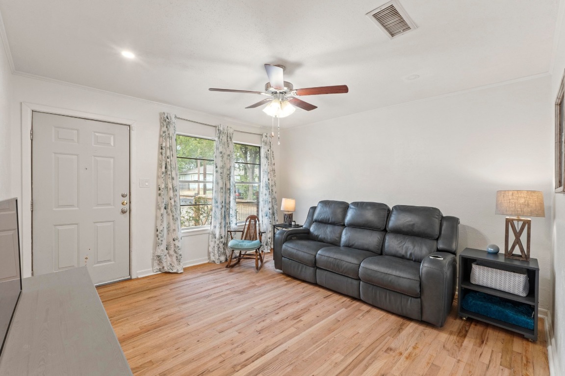 1805 Vine Street Georgetown, TX 78626 - Photo 4 of 32 a living room with furniture and a wooden floor