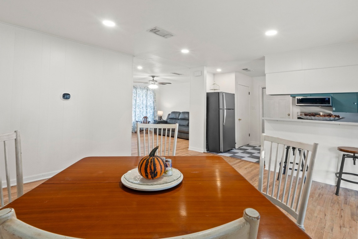 1805 Vine Street Georgetown, TX 78626 - Photo 8 of 32 a kitchen with stainless steel appliances a table and chairs
