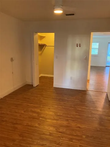 a bathroom with a shower and toilet