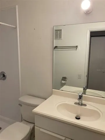 a bathroom with a sink and a large mirror