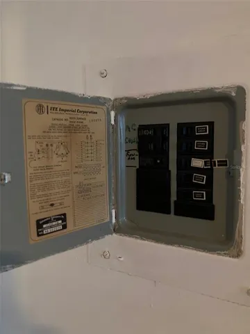 a room with pool table and windows