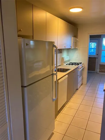 a kitchen with a stove and a microwave