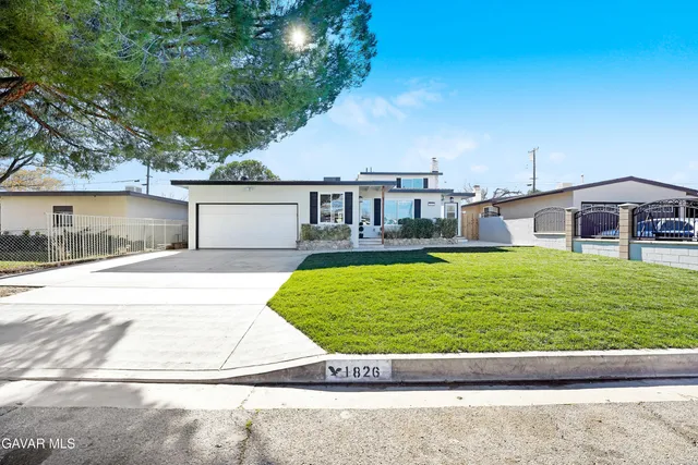 a view of a house with a swimming pool