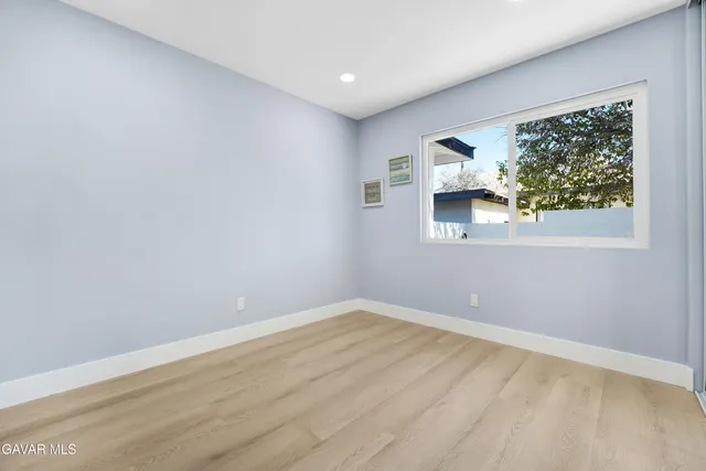 a bathroom with a double vanity sink toilet mirror and shower