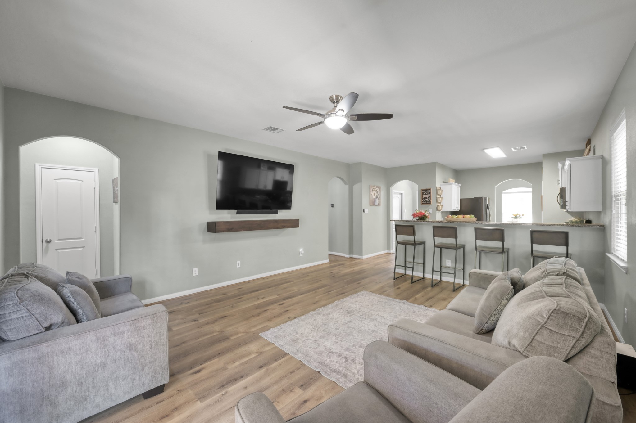 7562 Fettle Lane Conroe, TX 77304 - Photo 14 of 30 Large open-concept living room ideal for entertaining and relaxing.