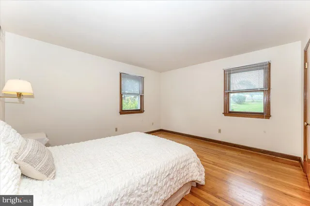 a bathroom with a toilet a sink and a mirror