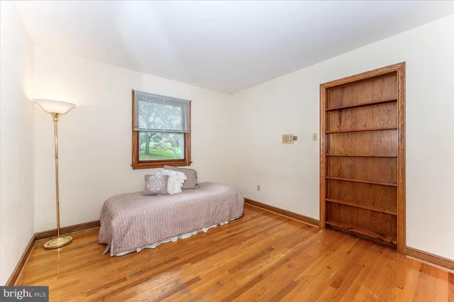 a bathroom with a granite countertop sink a toilet and a shower