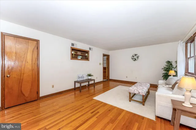 a view of a livingroom with furniture and wooden floor