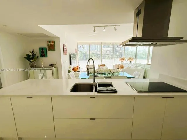 a kitchen with sink and window