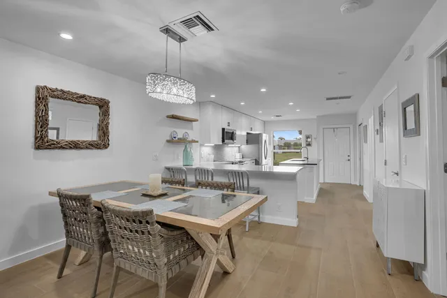 a kitchen with a table and chairs in it